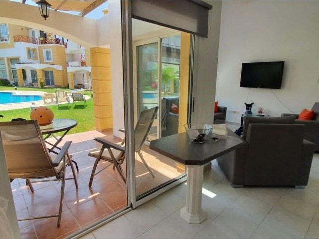 1+1 ground floor duplex apartment with garden in a well-maintained site 500m from the sea in Kyrenia Alsancak. Fully Furnished (can be converted to 2+1). 05338403555 ** 