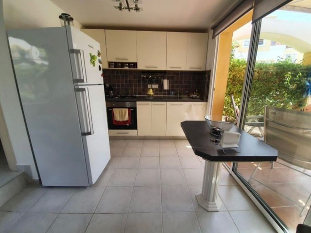 1+1 ground floor duplex apartment with garden in a well-maintained site 500m from the sea in Kyrenia Alsancak. Fully Furnished (can be converted to 2+1). 05338403555 ** 