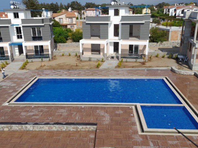 Turkish deed apartments in a complex with a pool, 300 meters from the sea in Karsiyaka, Girne. With ground floor or upper floor terrace options. 05338403555 ** 