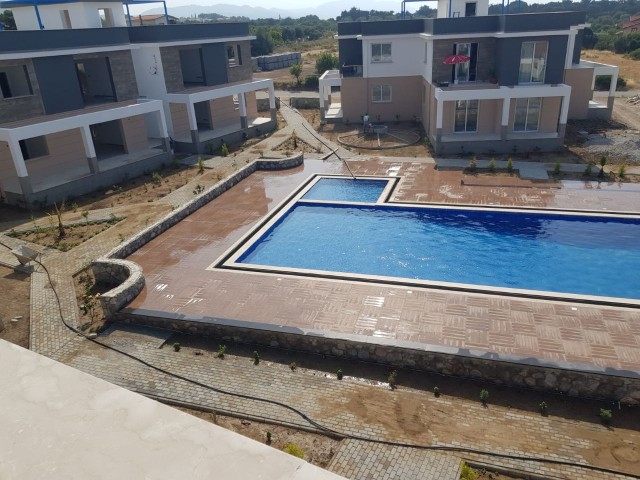 Turkish deed apartments in a complex with a pool, 300 meters from the sea in Karsiyaka, Girne. With ground floor or upper floor terrace options. 05338403555 ** 