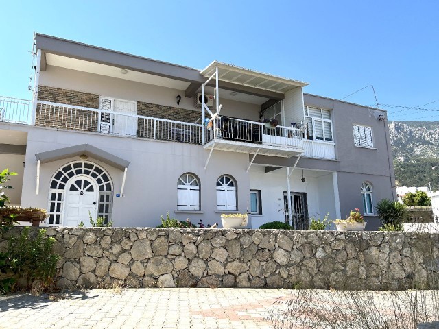 A detached house located in a 1200m2 land consisting of 4 apartments in Kyrenia Laptada is for sale. 05338403555 ** 