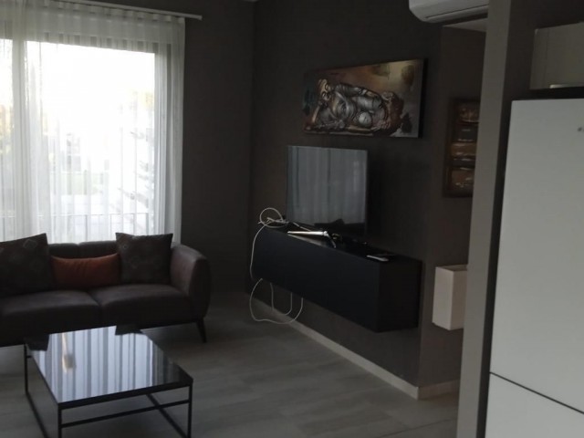 Fully furnished apartment with ground floor garden in a well-kept complex with 24x7 security in Alsancak, Kyrenia. 05338403555