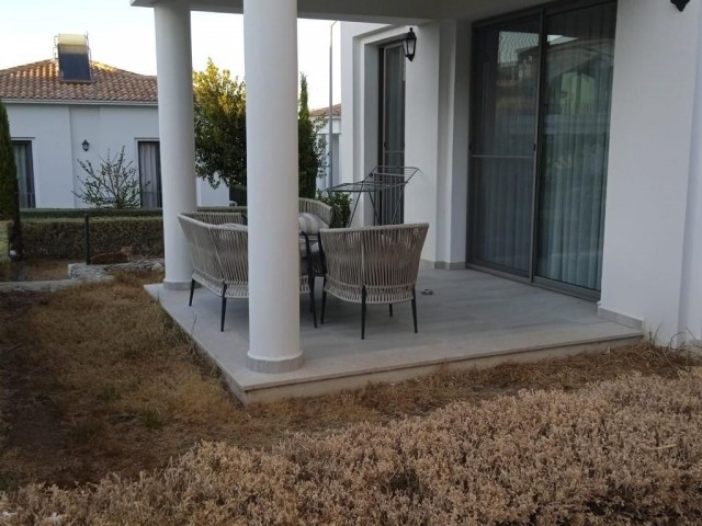 Fully furnished apartment with ground floor garden in a well-kept complex with 24x7 security in Alsancak, Kyrenia. 05338403555