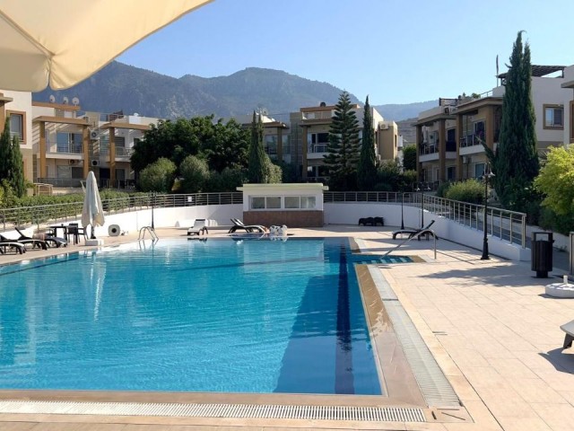 1st floor 1+1 flat in a complex with a pool in Kyrenia, Alsancak. The stub is ready, VAT has been paid.05338403555
