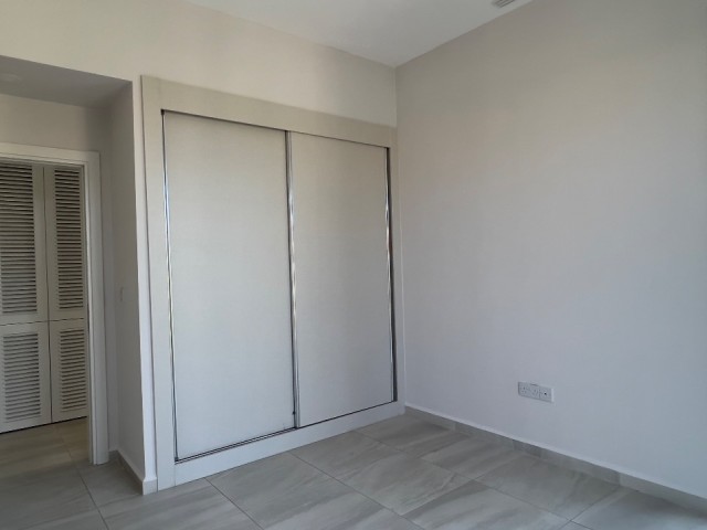 2+1 ground floor flat with garden in Kyrenia Alsancak Kıbrıs Town site with 24/7 security. 05338403555