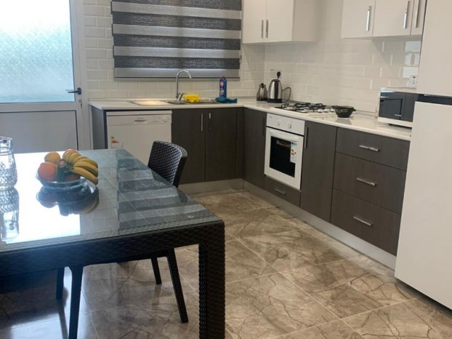 Ground floor, fully furnished luxury apartment in Kyrenia Karsiyaka, 200 meters from the beach and restaurants, 500 meters from the main road and markets, in a complex with pool. . ,