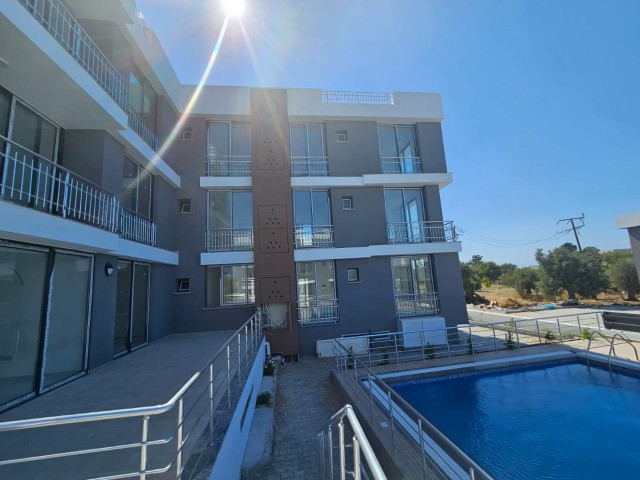 2+1 FIRST FLOOR FLAT SITE WITH POOL FOR SALE IN GIRNE LAPTA (050823Mr03)