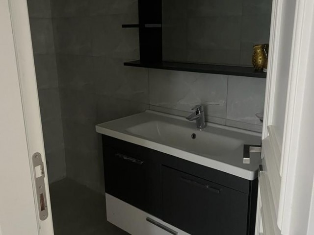 2+1 flat for rent in Kyrenia center with open pool, dues included, Turkish bath, gym, massage included