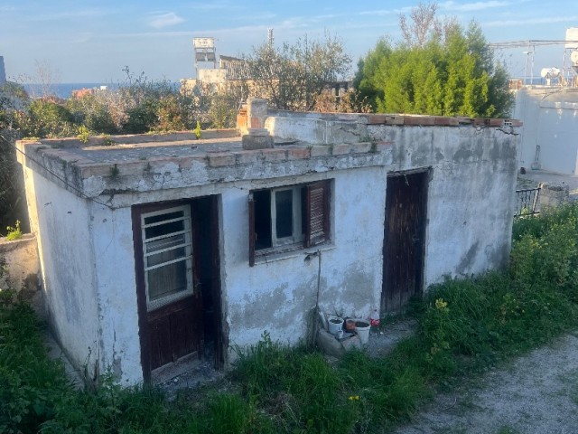 Village house in need of renovation in Alsancak is for sale