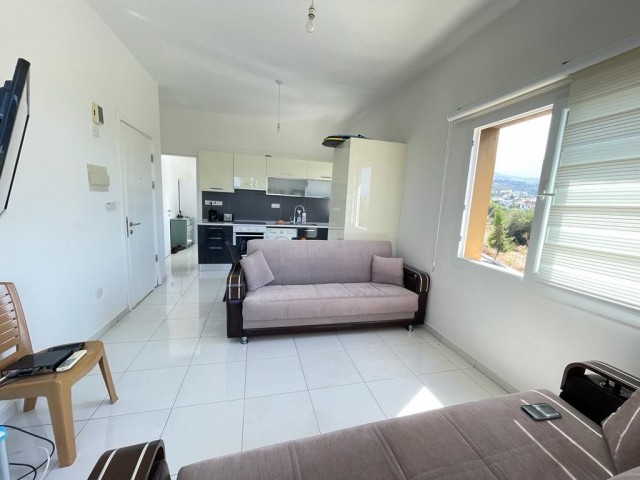 Furnished 1+1 Flat with a Large Terrace FOR SALE in a Site with a Pool in Alsancak Region!