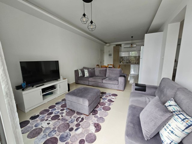 A SPECIAL FLAT FOR THOSE WHO ARE LOOKING FOR AN APARTMENT WITH A GARDEN! INVESTMENT OPPORTUNITY IN ALSANCAK LOTUS PARK!