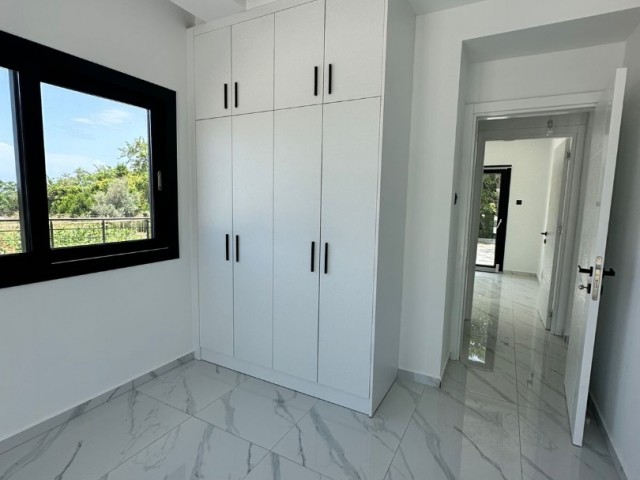 2+1 flat for sale in Kyrenia Alsancak, within walking distance to the sea, with a garden floor