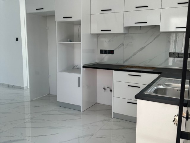 2+1 flat for sale in Kyrenia Alsancak, within walking distance to the sea, with a garden floor