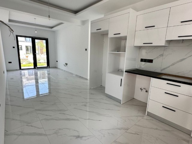 2+1 flat for sale in Kyrenia Alsancak, within walking distance to the sea, with a garden floor