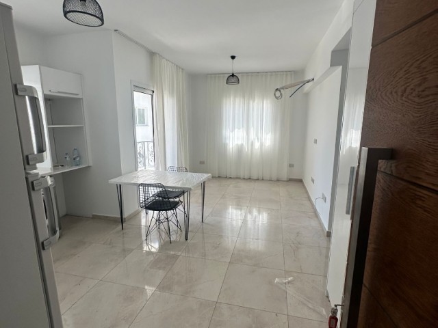 Brand new, semi-furnished 1+1 flat for sale in Alsancak, Kyrenia, in a site close to the sea