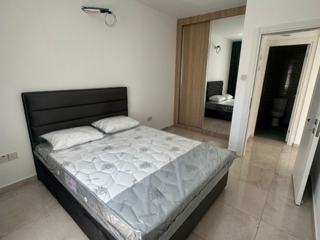 Brand new, semi-furnished 1+1 flat for sale in Alsancak, Kyrenia, in a site close to the sea