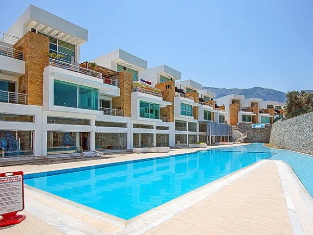 Duplex apartment for sale in Dogankoy with 2 bedrooms + swimming pool + semi-furnished + white furnished + air conditioning ** 