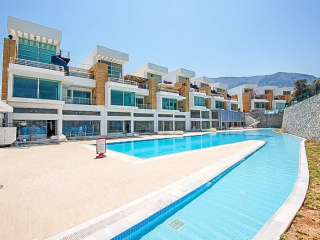 Duplex apartment for sale in Dogankoy with 2 bedrooms + swimming pool + semi-furnished + white furnished + air conditioning ** 