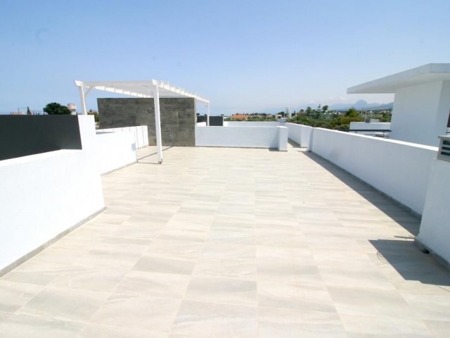 Newly Constructed 2 + 1 Apartment with large roof terrace and shared pool in the heart of Ozankoy