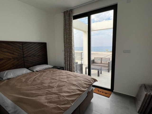 Brand New Luxury 2 + 1 Garden Apartment Front Line to the Sea with Shared Pool and Gym