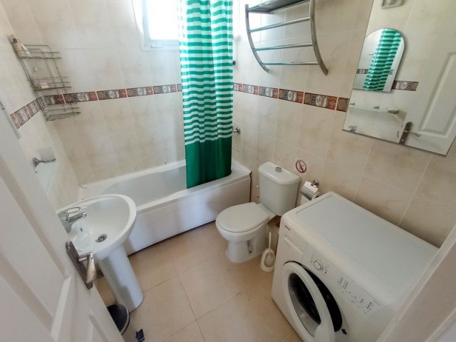 2 bedroom garden resale apartment + fully furnished + communal pools + gated security + Title deed in the owner’s name, VAT paid