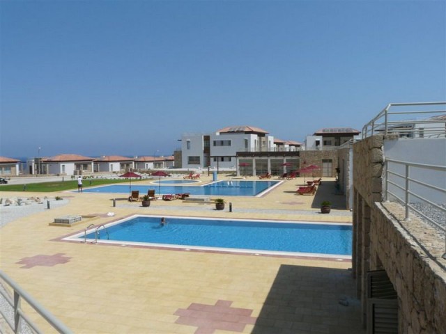 3 bedroom garden apartment + fully furnished + direct sea views + 4 communal swimming pools & sauna + Title deed in the owner’s name, VAT paid