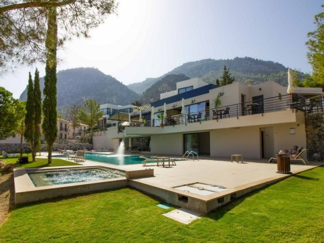 2 bedroom modern penthouse apartment + part of an award winning boutique hotel and wine farm + communal swimming pool + gym + cafe + sauna + children’s playground + beautiful sea and mountains views