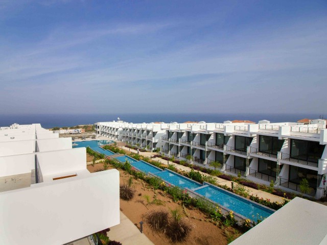 Modern resale studio ground apartment + sea side + communal pool + walking distance to the beach