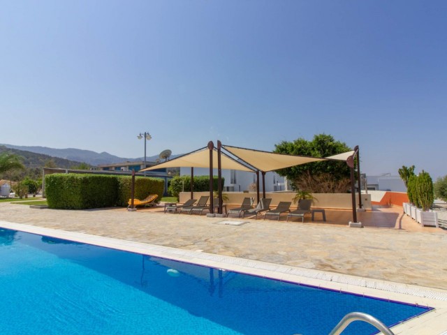 1 bedroom seaside garden apartment + communal swimming pool + within a complex + Sea and Mountains views + walking distance to the beach