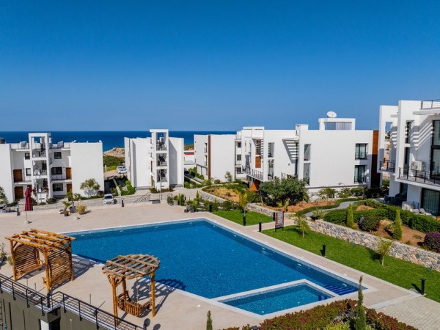 1-bedroom modern garden apartment + fully furnished + communal swimming pool + bar + walking distance to the beach and supermarket + sea and mountain views