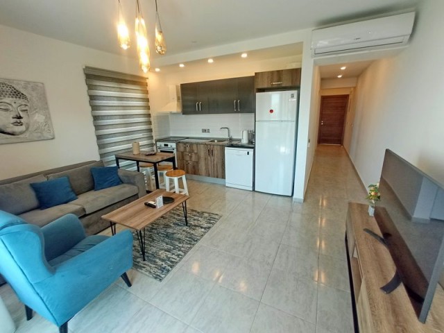 1-bedroom modern garden apartment + fully furnished + communal swimming pool + bar + walking distance to the beach and supermarket + sea and mountain views