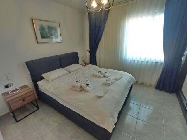 1-bedroom modern garden apartment + fully furnished + communal swimming pool + bar + walking distance to the beach and supermarket + sea and mountain views