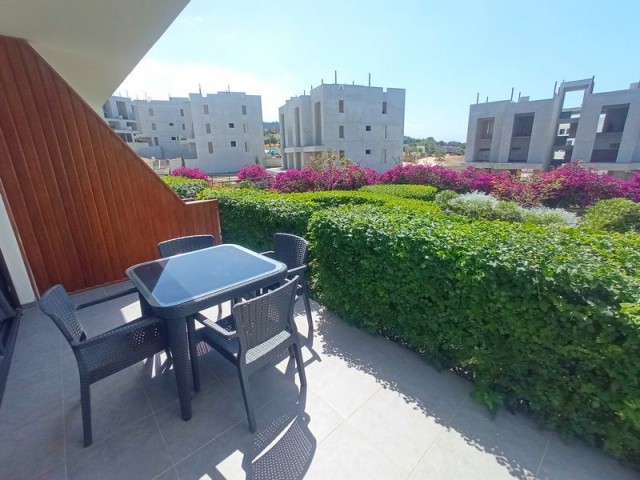 1-bedroom modern garden apartment + fully furnished + communal swimming pool + bar + walking distance to the beach and supermarket + sea and mountain views