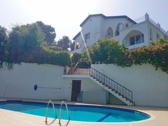 4-bedroom resale villa + 10m2 x 5m2 heated swimming pool + fully furnished + gym + snooker game room + wine cellar + storage room + double garage + bar near the pool + uninterrupted sea and mountain views + Pre-74 Turkish title deed in the owner’s name, VAT paid