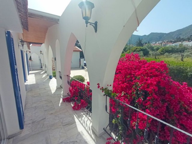 4-bedroom resale villa + 10m2 x 5m2 heated swimming pool + fully furnished + gym + snooker game room + wine cellar + storage room + double garage + bar near the pool + uninterrupted sea and mountain views + Pre-74 Turkish title deed in the owner’s name, VAT paid