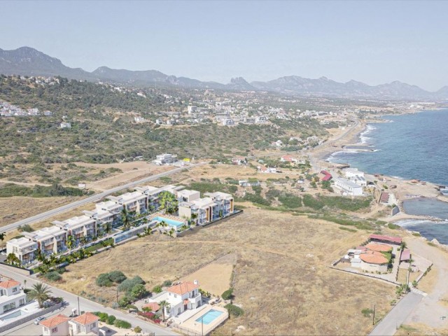 Seafront 1+1 apartment with garden and 1+1 penthouse for sale in Esentepe