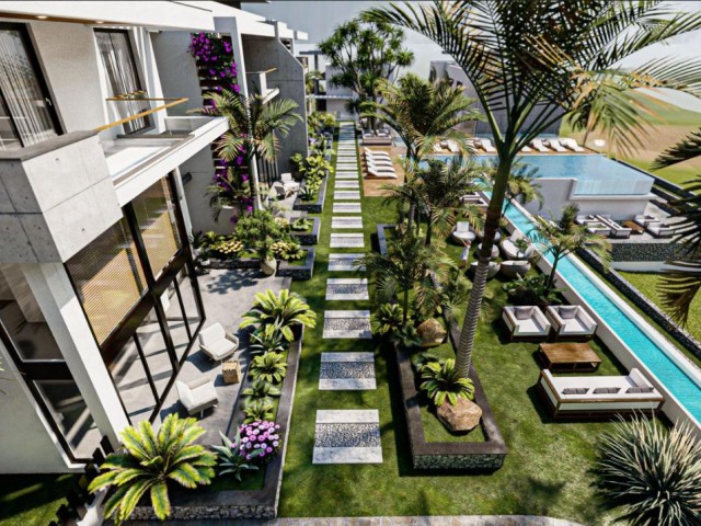 Seafront 1+1 apartment with garden and 1+1 penthouse for sale in Esentepe