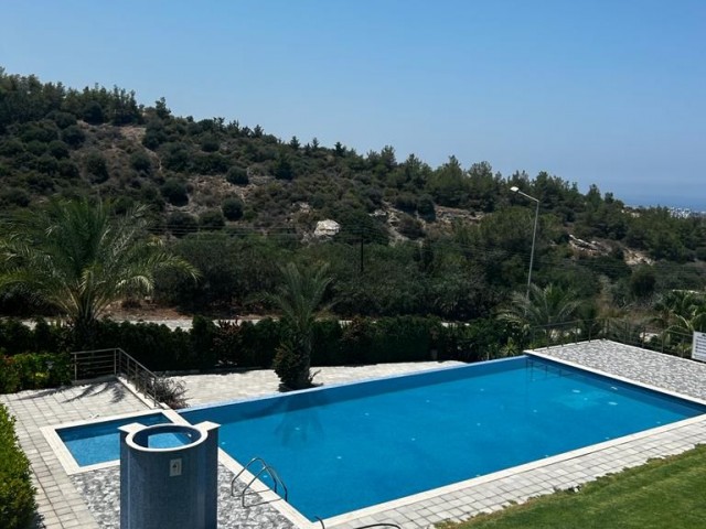 2+1 luxury apartment for sale with communal swimming pool in Girne , Belapais