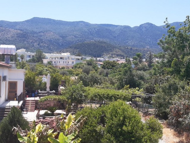 A villa with 3 Bedrooms  and a small garden close to the city centre and markets with sea and mountain views