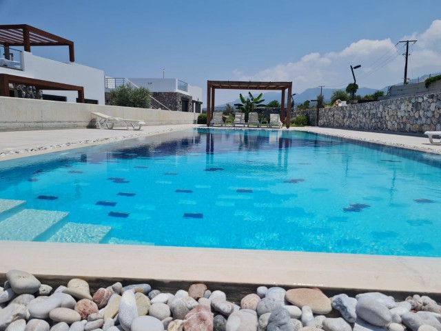 A beautiful 3 +1 BUNGALOW with communal swimming pool and stunnind sea and mountain views. Doğan Boransel - 0533-8671911