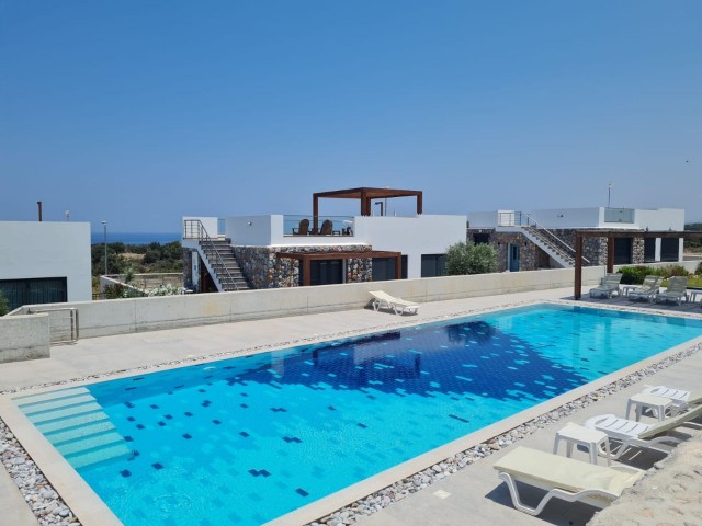 A beautiful 3 +1 BUNGALOW with communal swimming pool and stunnind sea and mountain views. Doğan Boransel - 0533-8671911