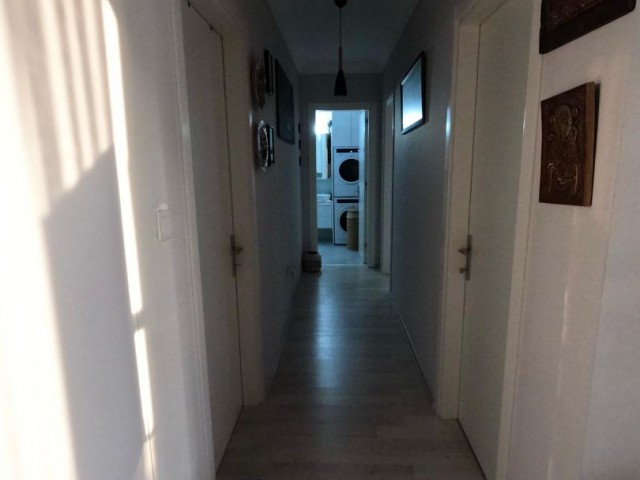 IN ALSANCAK, 3+1 COOMUNUAL SWIMMING POOL, NICE DESIGNED, OPEN PLAN KITCHEN LIVINGROOM, VERY WARM+ LIGHT ROOMS, IN A CENTRE AREA, GROUND FLOORAT DAİRE