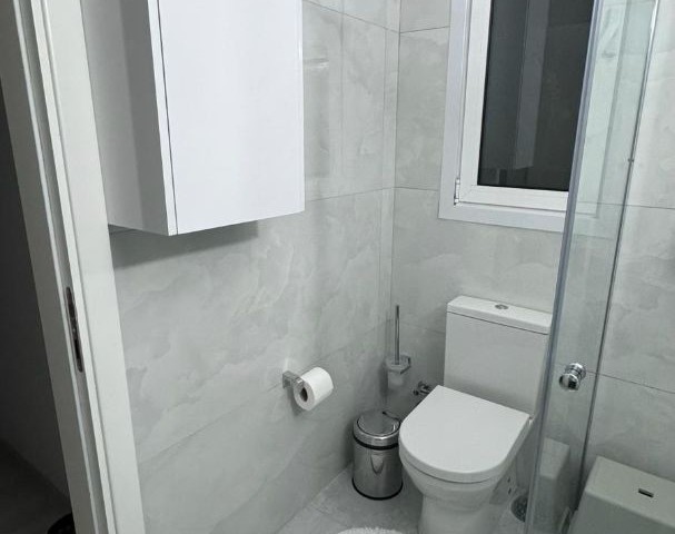 IN ALSANCAK, 3+1 COOMUNUAL SWIMMING POOL, NICE DESIGNED, OPEN PLAN KITCHEN LIVINGROOM, VERY WARM+ LIGHT ROOMS, IN A CENTRE AREA, GROUND FLOORAT DAİRE