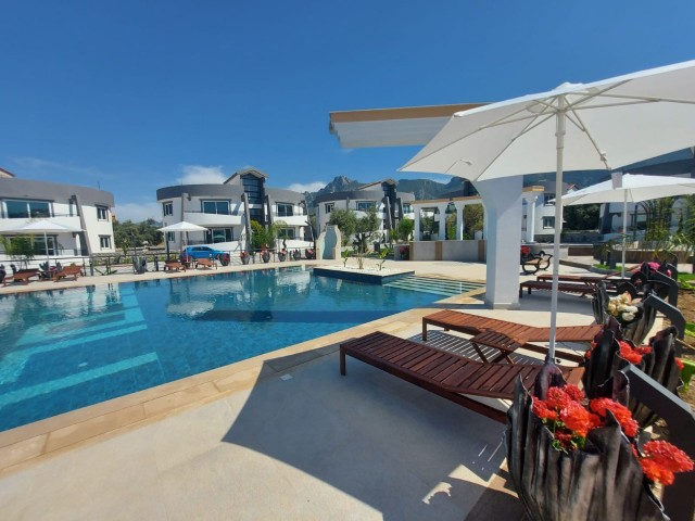 1 + 1 rental apartment with zero furniture in a secure site with a shared pool near the ring road in Karaoglanoglu ** 