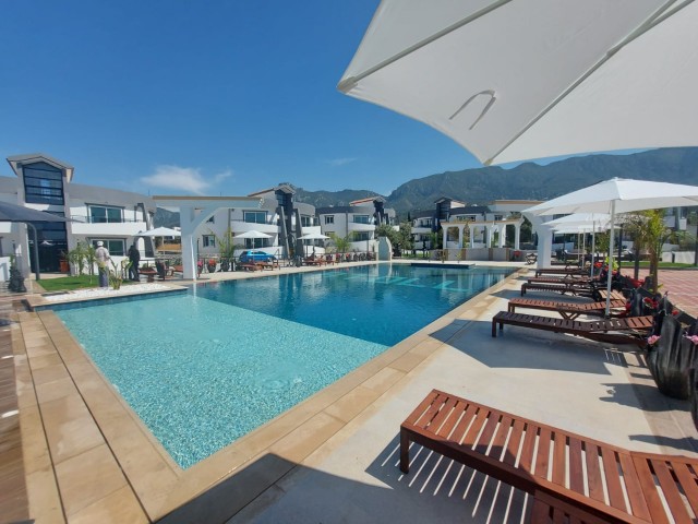 1 + 1 rental apartment with zero furniture in a secure site with a shared pool near the ring road in Karaoglanoglu ** 