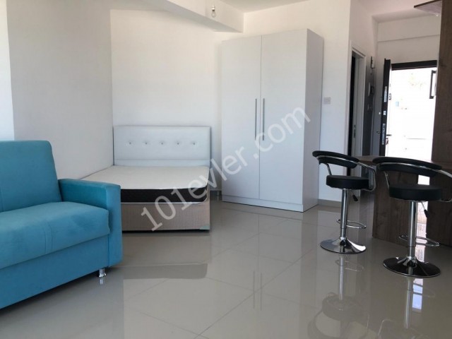 Studio apartment for sale in Alsancak within walking distance to the main street with communal pool with sea view roof terrace belonging to the apartment fully furnished all expenses paid
