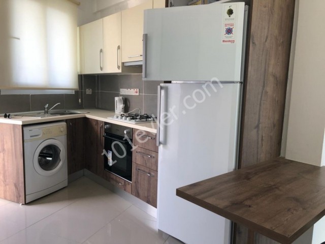 Studio apartment for sale in Alsancak within walking distance to the main street with communal pool with sea view roof terrace belonging to the apartment fully furnished all expenses paid