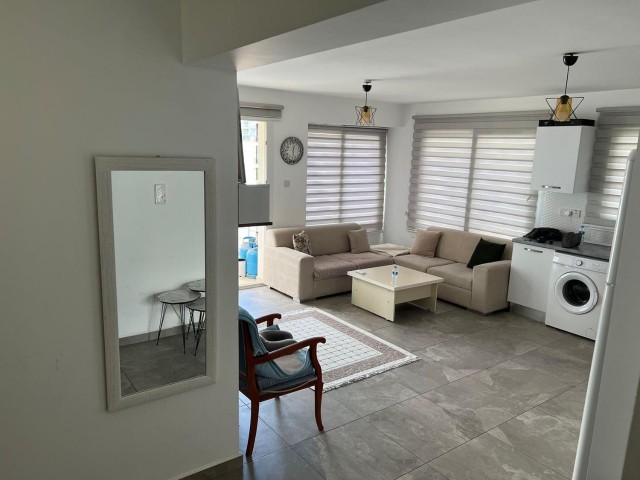 Furnished 3+1 flat for sale in a centrally located building with elevator in Kyrenia