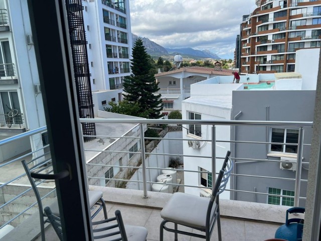 Furnished 3+1 flat for sale in a centrally located building with elevator in Kyrenia