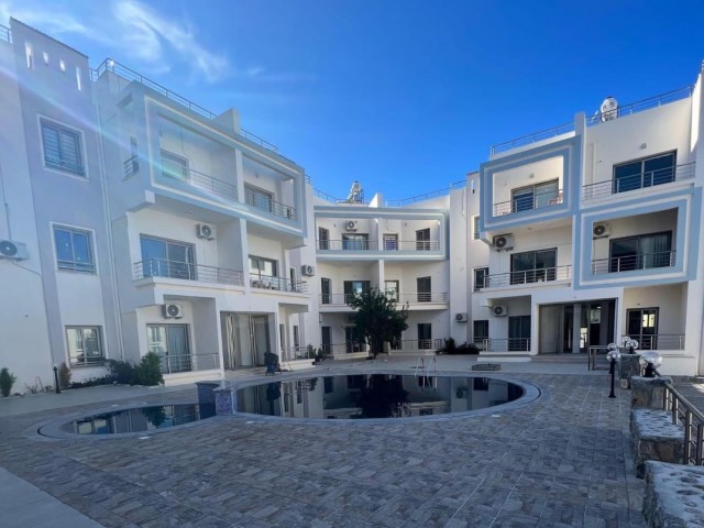 New 2+1 flat for sale in a centrally located site with a shared pool in Alsancak